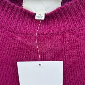Burgundy/white sweater. Very soft and comfortable, wide sleeves.